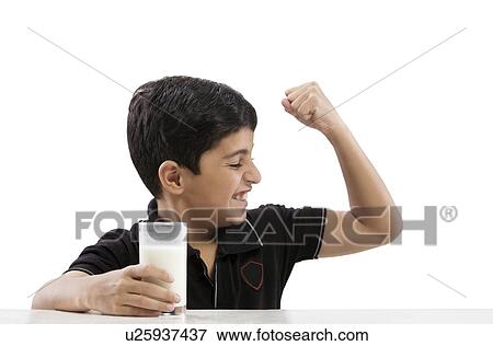 Young boy flexing his arm View Large Photo Image Stock Photo - Young boy flexing his arm . Fotosearch