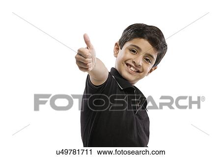 Stock Image - Young boy giving a thumbs up . Fotosearch
