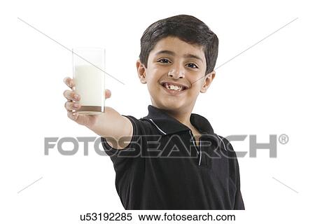 Young boy holding a glass of milk View Large Photo Image Stock Photography - Young boy holding a glass of milk . Fotosearch