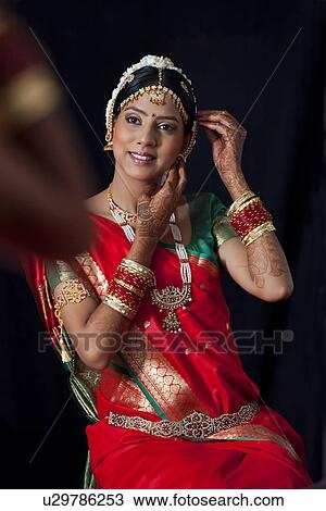 Young bride getting ready for her wedding View Large Photo Image Stock Image - Young bride getting ready for her wedding . Fotosearch