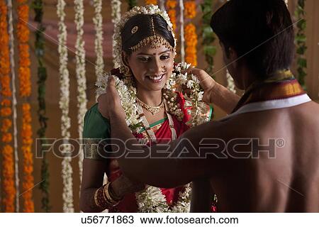 Stock Image - Young couple during wedding ceremony . Fotosearch