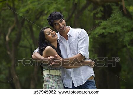Stock Image - Young couple hugging each other . Fotosearch