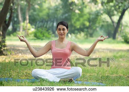 Stock Photograph - Young fresh woman in a yoga pose . Fotosearch