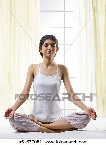 Young girl meditating View Large Photo Image Stock Image - Young girl meditating . Fotosearch