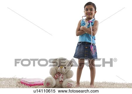 Young girl standing next to her teddy bear View Large Photo Image Stock Photography - Young girl standing next to her teddy bear . Fotosearch