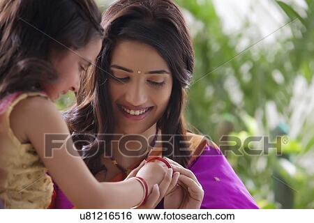 Stock Photograph - Young girl wearing bangles . Fotosearch