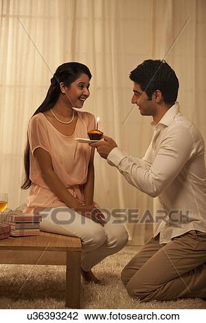 Young loving couple celebrating together at home View Large Photo Image Stock Image - Young loving couple celebrating together at home . Fotosearch