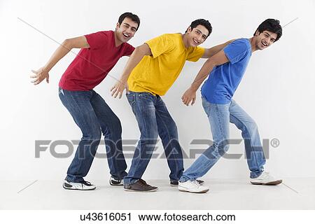 Stock Image - Young male friends in playful mood . Fotosearch