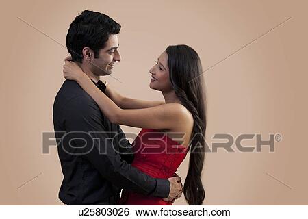 Stock Photograph - Young man and woman in love . Fotosearch