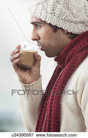 Young man drinking tea View Large Photo Image Stock Photo - Young man drinking tea . Fotosearch