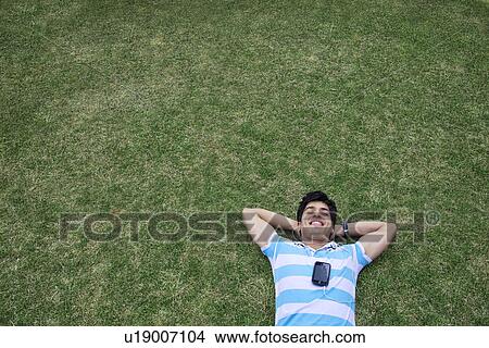 Picture - Young man listening to music . Fotosearch