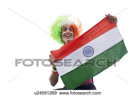 Young man with a wig holding the Indian flag View Large Photo Image Stock Photo - Young man with a wig holding the Indian flag . Fotosearch