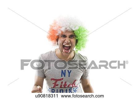 Young man with a wig shouting View Large Photo Image Stock Image - Young man with a wig shouting . Fotosearch