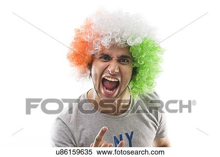 Young man with a wig shouting View Large Photo Image Stock Photography - Young man with a wig shouting . Fotosearch