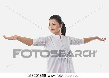 Young smiling woman with arms outstretched View Large Photo Image Stock Photograph - Young smiling woman with arms outstretched . Fotosearch