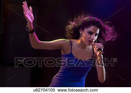 Young woman singing View Large Photo Image Stock Photography - Young woman singing . Fotosearch