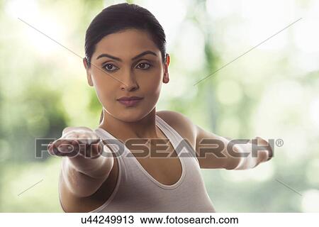 Young woman with arms outstretched against glass View Large Photo Image Stock Image - Young woman with arms outstretched against glass. Fotosearch