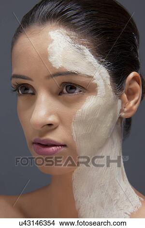 Young woman with facial mask View Large Photo Image Picture - Young woman with facial mask . Fotosearch