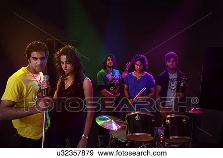 Stock Photo - Youngsters in a rock band . Fotosearch