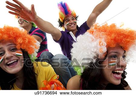 Picture - Youngsters with wigs cheering . Fotosearch