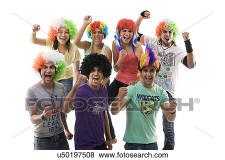 Stock Photo - Youngsters with wigs cheering . Fotosearch