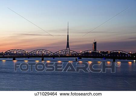 Arch bridge and Riga Radio and TV Tower at sunrise View Large Photo Image Picture - Arch bridge and Riga Radio and TV Tower at sunrise. Fotosearch