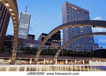 Arches over ice rink and skyscrapers against sky View Large Photo Image Stock Image - Arches over ice rink and skyscrapers against sky. Fotosearch