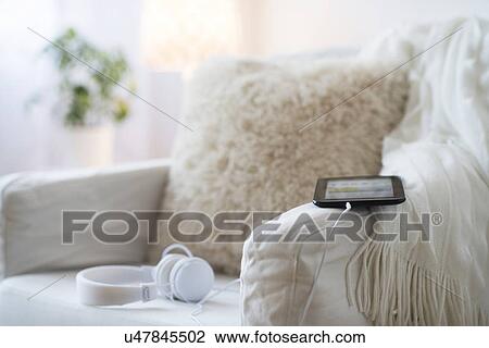 Armchair with digital tablet and headphones View Large Photo Image Stock Image - Armchair with digital tablet and headphones . Fotosearch