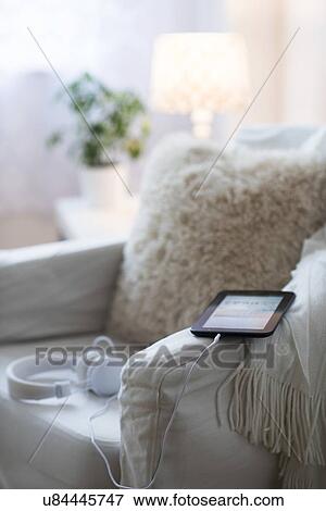 Armchair with digital tablet and headphones View Large Photo Image Stock Photo - Armchair with digital tablet and headphones . Fotosearch