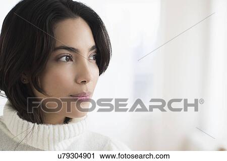 Attractive brunette woman looking away View Large Photo Image Stock Image - Attractive brunette woman looking away. Fotosearch
