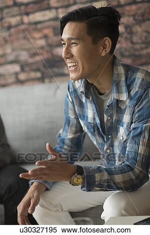 Cheerful man laughing View Large Photo Image Stock Photography - Cheerful man laughing. Fotosearch