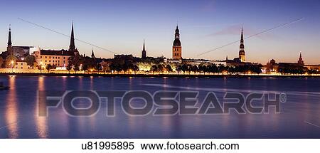 Stock Photography - City reflecting in River Daugava. Fotosearch