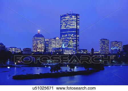 Stock Image - City skyline at dusk. Fotosearch