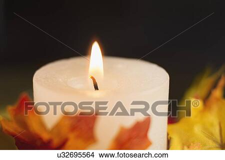 Close-up of burning candle View Large Photo Image Picture - Close-up of burning candle. Fotosearch