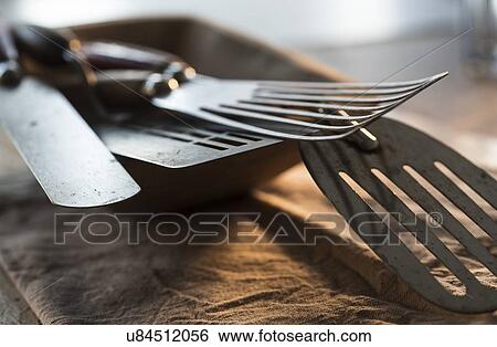 Stock Photograph - Close up of old kitchen utensils. Fotosearch