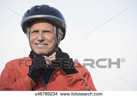 Close up of senior man in biking helmet View Large Photo Image Picture - Close up of senior man in biking helmet. Fotosearch