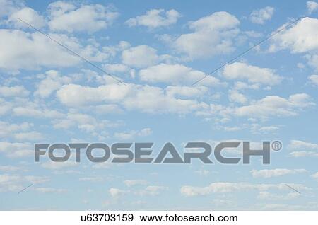 Stock Photo - Clouds in blue sky. Fotosearch