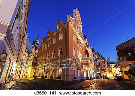 Corner of illuminated building against blue dusk sky View Large Photo Image Stock Image - Corner of illuminated building against blue dusk sky. Fotosearch