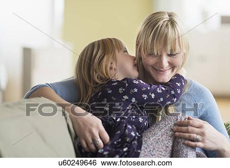 Daughter (4-5) telling secret to mother View Large Photo Image Stock Photograph - Daughter (4-5) telling secret to mother . Fotosearch