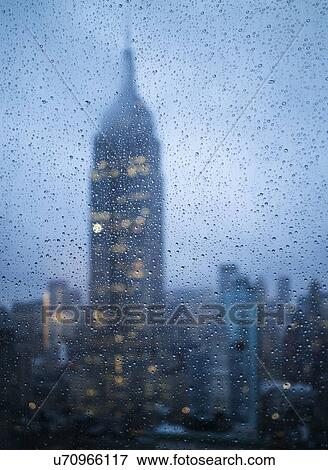 Stock Photo - Empire State Building in rain. Fotosearch