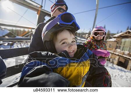 Father skiing with children (6-7, 8-9) View Large Photo Image Stock Image - Father skiing with children (6-7, 8-9). Fotosearch