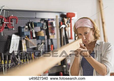 Female carpenter at work View Large Photo Image Stock Image - Female carpenter at work. Fotosearch