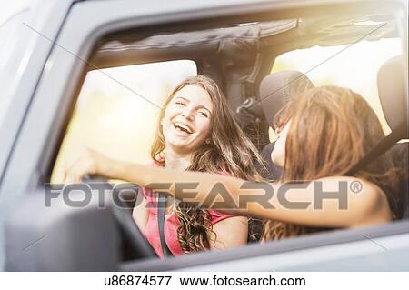 Female friends (14-15) during road trip View Large Photo Image Stock Photo - Female friends (14-15) during road trip. Fotosearch