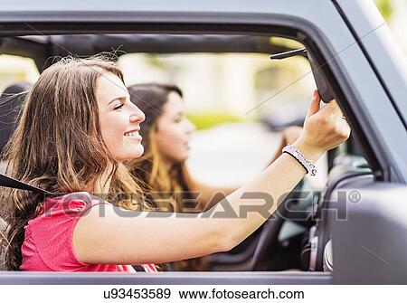 Female friends (14-15) during road trip View Large Photo Image Stock Photo - Female friends (14-15) during road trip. Fotosearch