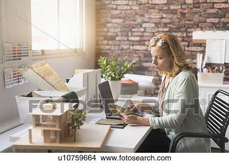 Female interior designer at work View Large Photo Image Picture - Female interior designer at work. Fotosearch