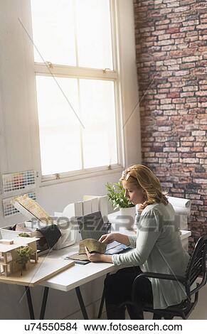 Female interior designer at work View Large Photo Image Picture - Female interior designer at work. Fotosearch