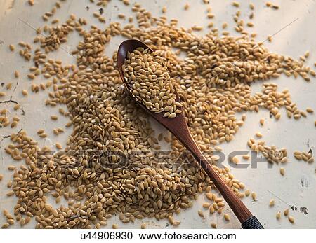 Flax seeds and wooden spoon on white View Large Photo Image Stock Image - Flax seeds and wooden spoon on white. Fotosearch