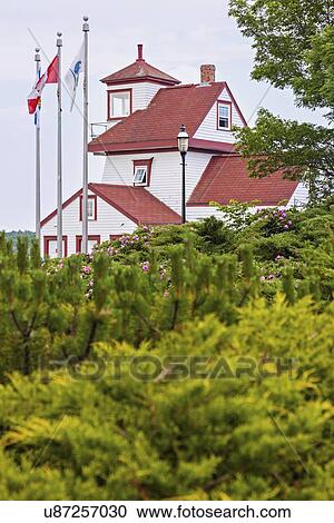 Fort Point Lighthouse and bushes in foreground View Large Photo Image Stock Image - Fort Point Lighthouse and bushes in foreground. Fotosearch