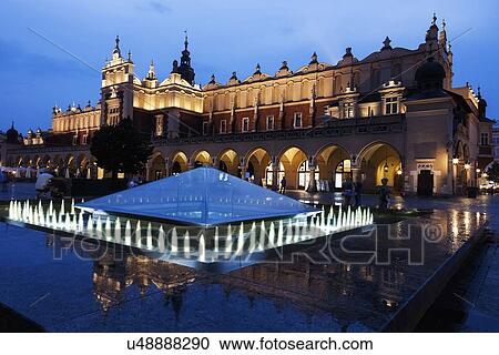 Stock Image - Fountain and Cloth Hall evening time. Fotosearch