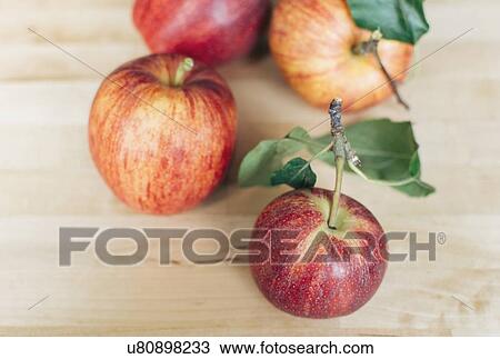 Stock Image - Four red apples. Fotosearch